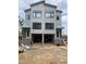 New construction, modern home featuring large windows and a gray facade at 1105 Glascock St # 102, Raleigh, NC 27610