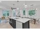Spacious kitchen featuring a large island, stainless steel appliances, and a view into the living room at 1105 Glascock St # 102, Raleigh, NC 27610