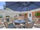 Cozy backyard deck featuring an umbrella table and comfortable wicker chairs for outdoor enjoyment at 127 Fairfield Cir, Dunn, NC 28334