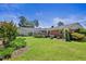 Lush green backyard showcasing a beautiful patio area perfect for outdoor gatherings and relaxation at 127 Fairfield Cir, Dunn, NC 28334