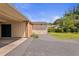 Long driveway leading to a detached garage and carport at 127 Fairfield Cir, Dunn, NC 28334