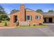 Charming brick home with green shutters and a well-maintained front yard at 127 Fairfield Cir, Dunn, NC 28334