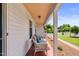 Inviting front porch with stylish seating, perfect for enjoying the meticulously landscaped front yard at 127 Fairfield Cir, Dunn, NC 28334