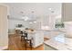 Bright open kitchen with island, granite countertops, and stainless steel appliances at 127 Fairfield Cir, Dunn, NC 28334