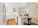 Bright kitchen with white cabinets, stainless steel appliances, and a granite-topped island at 127 Fairfield Cir, Dunn, NC 28334