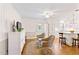Inviting open-concept living area with wood floors, wicker chairs, and a breakfast bar at 127 Fairfield Cir, Dunn, NC 28334