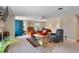 Spacious living room with comfortable seating, a decorative rug, and a blue front door at 127 Fairfield Cir, Dunn, NC 28334