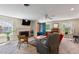 Comfortable living room featuring a brick fireplace, bright windows and comfortable seating at 127 Fairfield Cir, Dunn, NC 28334