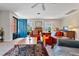 Cozy living room features comfy seating, hardwood desk, and a view of the front yard at 127 Fairfield Cir, Dunn, NC 28334