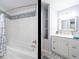 Updated bathroom with white vanity, tile shower, and separate tub at 1301 S 14Th St, Lillington, NC 27546