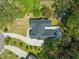Aerial view of the property with a well-maintained roof, large deck, and surrounding greenery at 1408 Ferrell Ct, Creedmoor, NC 27522