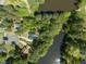 A stunning aerial view shows the home's location next to a serene lake surrounded by lush greenery at 1408 Ferrell Ct, Creedmoor, NC 27522