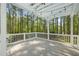 Inviting outdoor deck featuring a stylish pergola with string lights and wooded backdrop at 1408 Ferrell Ct, Creedmoor, NC 27522