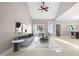A living room is staged with neutral furniture and decor at 1408 Ferrell Ct, Creedmoor, NC 27522