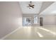 The airy living room features tall ceilings and access to the backyard deck at 1408 Ferrell Ct, Creedmoor, NC 27522