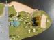 Aerial view of waterfront park featuring a sand beach, green space, and recreational facilities at 145 Ottawa Dr, Louisburg, NC 27549