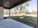 Covered porch overlooking private backyard at 145 Ottawa Dr, Louisburg, NC 27549
