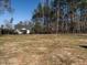 The backyard has plenty of space for the dogs to run around at 145 Ottawa Dr, Louisburg, NC 27549