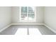 Bright bedroom with a large window offering natural light at 145 Ottawa Dr, Louisburg, NC 27549