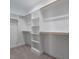 Spacious walk-in closet with built-in shelving and plenty of storage space at 145 Ottawa Dr, Louisburg, NC 27549
