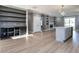 Spacious home design with laminate flooring, a bar, and a combined kitchen with stainless steel appliances at 145 Ottawa Dr, Louisburg, NC 27549