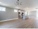 Open-concept living room and kitchen area with stainless steel appliances and a kitchen island at 145 Ottawa Dr, Louisburg, NC 27549