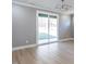 Spacious living room with sleek flooring and large sliding glass doors providing ample natural light at 145 Ottawa Dr, Louisburg, NC 27549