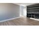 An open-concept living area features durable laminate flooring, gray walls and a built-in bar at 145 Ottawa Dr, Louisburg, NC 27549
