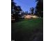 Exterior shot of a home at twilight featuring a well-maintained lawn and inviting front porch at 1521 Cross Link Rd, Raleigh, NC 27610