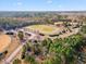 An aerial view of the track field, tree line, and sky at 4708 River Boat Landing Ct, Raleigh, NC 27604