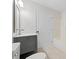 This bathroom showcases a modern vanity, toilet, and tiled shower/tub combination at 4708 River Boat Landing Ct, Raleigh, NC 27604