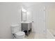 Bathroom features a modern vanity, toilet, and mirror with a shower/tub combination at 4708 River Boat Landing Ct, Raleigh, NC 27604