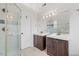 Bathroom featuring double vanity sinks with a large glass shower at 4708 River Boat Landing Ct, Raleigh, NC 27604