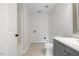 This bathroom features a modern gray vanity, toilet, and shower/tub combination at 4708 River Boat Landing Ct, Raleigh, NC 27604