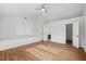 Spacious bedroom with hardwood floors, a ceiling fan, and bonus storage at 4708 River Boat Landing Ct, Raleigh, NC 27604