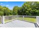 Spacious wooden deck showcasing sturdy white railings, perfect for outdoor relaxation and entertaining at 4708 River Boat Landing Ct, Raleigh, NC 27604