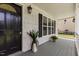 Covered front porch featuring a stylish front door, and decorative plants at 4708 River Boat Landing Ct, Raleigh, NC 27604