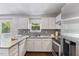 Kitchen with stainless appliances and gray countertops at 4708 River Boat Landing Ct, Raleigh, NC 27604