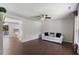 Bright living room with hardwood floors, a ceiling fan and ample natural light at 4708 River Boat Landing Ct, Raleigh, NC 27604