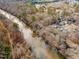 Aerial view of the river running through the trees and neighborhood at 4708 River Boat Landing Ct, Raleigh, NC 27604