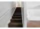 Carpeted staircase leading to the upper level of the home at 4708 River Boat Landing Ct, Raleigh, NC 27604