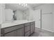 Bathroom featuring double vanity and gray tile flooring at 518 Donnegal Farm Dr, Fuquay Varina, NC 27526