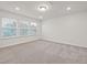 Bright bedroom featuring ample natural light and neutral carpeting at 518 Donnegal Farm Dr, Fuquay Varina, NC 27526
