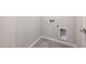 Convenient laundry room with tile flooring and built-in shelving at 518 Donnegal Farm Dr, Fuquay Varina, NC 27526