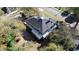 Large house with dark gray roof, viewed from the back, near a road and trees at 603 W Davis St, Burlington, NC 27215