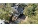 Two-story house with gray siding, visible from the backyard, surrounded by trees at 603 W Davis St, Burlington, NC 27215