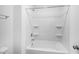 Bathroom featuring a built-in tub and shower with multiple storage shelves at 630 Contento Ct, Sanford, NC 27330