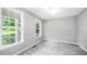 Bedroom with natural light provided by two windows, and modern ceiling fan at 630 Contento Ct, Sanford, NC 27330