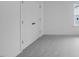 Carpeted bedroom featuring a double door closet and a window showing neighborhood houses at 630 Contento Ct, Sanford, NC 27330