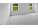 Light and airy bedroom with soft gray carpet and bright windows overlooking a green lawn at 630 Contento Ct, Sanford, NC 27330
